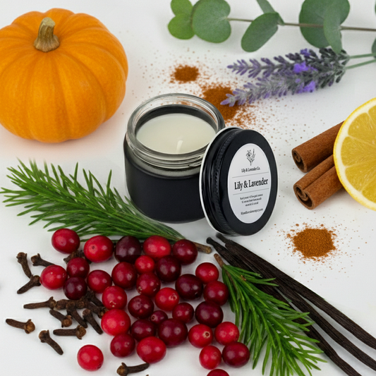Lily & Lavender Co. Non-toxic, essential oil Candle with 'Lily & Lavender' label surrounded by pumpkins, cinnamon sticks, and berries on a white surface.