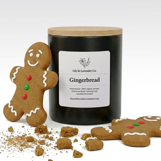 Gingerbread-themed candle with a gingerbread man cookie and crumbs on a white background