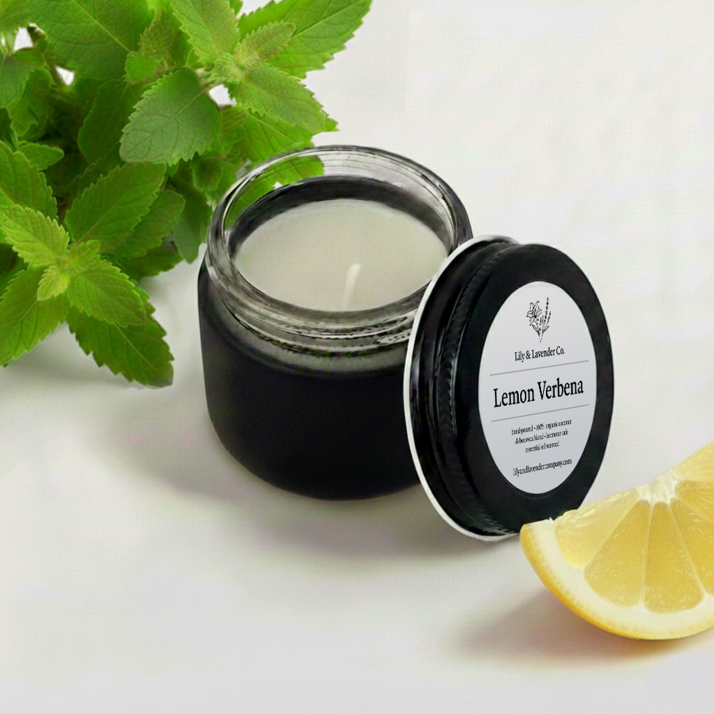 Lily & Lavender Co. Lemon Verbena, Essential Oil Scented, Non-Toxic Coconut & Beeswax Candle with a piece of lemon, and Lemon verbena bushel.