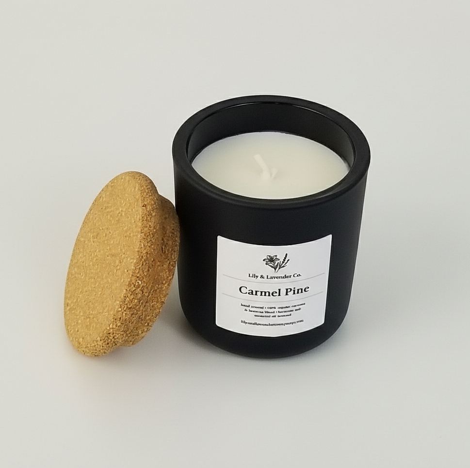 Lily & Lavender company, non-toxic Candle in a black container with a cork lid on a light gray background
