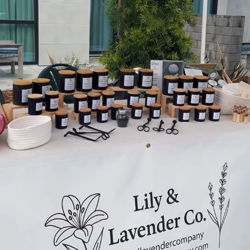 Local market booth and display of Lily and Lavender co non-toxic candles in Carmel, CA.
