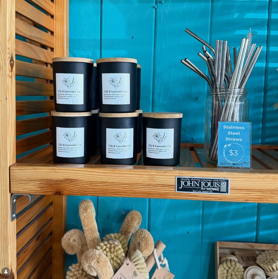 Lily & Lavender Candles on a wooden shelf at store that carries our candles
